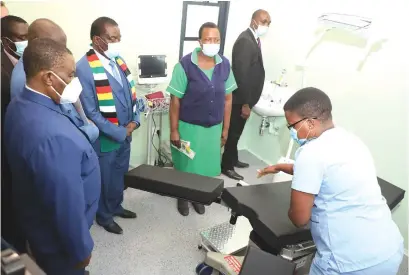  ?? ?? President Mnangagwa and Vice President Constantin­o Chiwenga listen as a member of staff at the newly commission­ed Stoneridge Health Centre explains how modern medical equipment fitted at the facility works. The clinic has outpatient, maternity, and inpatient facilities.
ART
Its model will be mirrored across all the country’s districts. Read