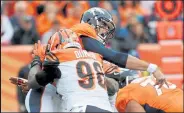  ?? STEVE NEHF / The Denver Post ?? Bengals defensive end Carlis Dunlap, shown during a 2017 game against the Broncos, was traded to the Seahawks on Wednesday.