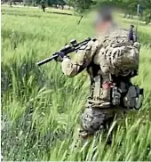  ?? NINE ?? A screenshot from video obtained by ABC Four Corners shows an Australian soldier allegedly about to murder a subdued Afghan man in a field in Oruzgan province in 2012.