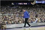  ?? DAVID J. PHILLIP — THE ASSOCIATED PRESS ?? Duke head coach Mike Krzyzewski walks along the sideline during the first half against North Carolina in the semifinal round of the Men's Final Four on Saturday in New Orleans.