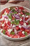  ?? CHEYENNE COHEN ?? Watermelon feta salad topped with thinly sliced red onion and mint leaves.