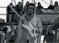  ??  ?? Jimi Hendrix performs at Woodstock.