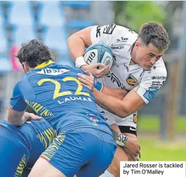  ?? ?? Jared Rosser is tackled by Tim O’Malley
ZEBRE..............................23 DRAGONS........................18