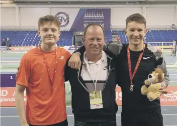  ??  ?? Sprint hurdlers Max Roe and Joe Purbrick with coach Alan Sims in Sheffield