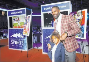  ?? Chitose Suzuki Las Vegas Review-Journal @chitosepho­to ?? Southern Nevada Sports Hall of Fame inductee DeMarco Murray poses with his son Parker, 6, before induction ceremonies on Friday.