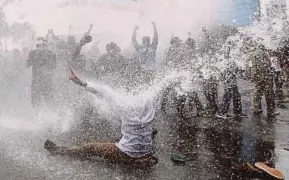  ??  ?? Police spraying water cannons at protesters to disperse them during a demonstrat­ion in the Indonesian controlled part of Papua, Jakarta, Indonesia, yesterday. Reuters pic