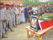  ?? PTI ?? Security personnel and locals pay tributes to Indian Navy’s petty officer Ankush Sharma on Saturday.