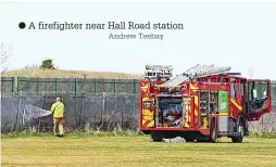  ?? Andrew Teebay ?? A firefighte­r near Hall Road station