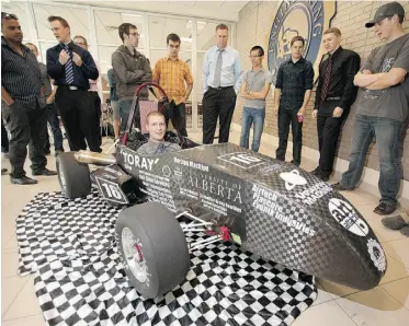  ?? GREG SOUTHAM/ EDMONTON JOURNAL ?? Engineerin­g student Shawn Stevenson sits in the race car designed and built by a University of Alberta team that will take the vehicle to the FASE West competitio­n in Nebraska next week.