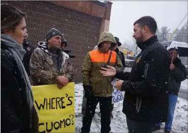  ?? FILE PHOTO BY WILLIAM J. KEMBLE ?? Ulster County Executive Pat Ryan, right foreground, meets with protesters near the Karolys debris-processing site on state Route 212 in Saugerties, N.Y., on Tuesday, Nov. 12.