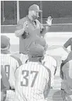  ?? ADAM LICHTENSTE­IN/ SUN SENTINEL ?? American Heritage coach Bruce Aven addresses his team after their win Wednesday over Wellington.