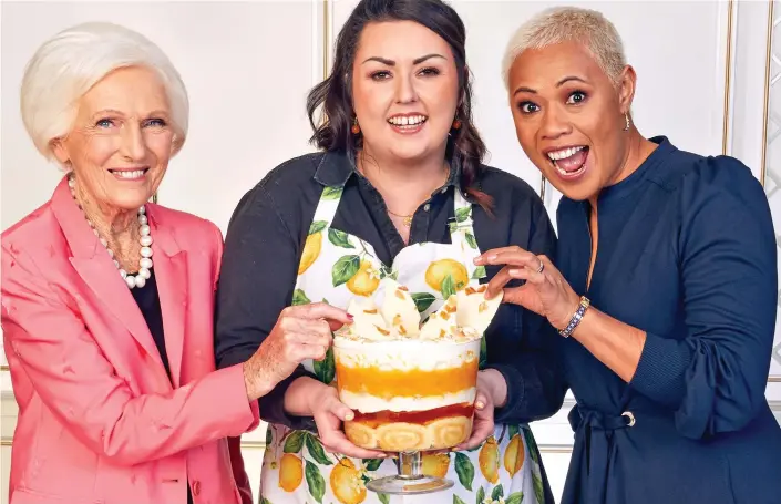  ?? ?? A royal creation: Jemma Melvin displays her trifle flanked by judges Dame Mary Berry, left, and Monica Galetti after being declared the competitio­n winner