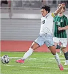  ?? BRYAN TERRY/THE OKLAHOMAN ?? Mustang’s Mung Mang goes for the ball against Edmond Santa Fe on April 4 in Edmond.