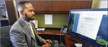  ?? CHRIS STEWART / STAFF ?? Montgomery County Recorder Brandon McClain demonstrat­es a fraud alert system that notifies enrolled property owners if changes are made to certain property records. This week the office rolled out a new system to accept documents filed online.