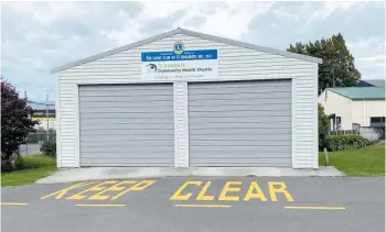  ?? Photo / Kate Durie ?? Te Awamutu Lions built the storage garage for both Te Awamutu Community Health Trust vehicles.