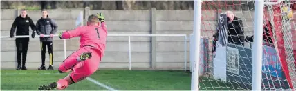  ??  ?? Josh Egan’s first-half free-kick for Bitton beats the Sutton Common Rovers goalkeeper and finds the back of the net