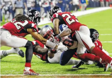  ?? THE ASSOCIATED PRESS ?? Atlanta’s Jalen Collins, left, and Robert Alford are unable to keep New England’s James White out of the end zone as he scores the winning touchdown during Super Bowl LI in Houston in February. The Falcons visit the Patriots tonight in their first...