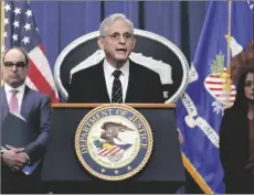  ?? PHOTO/CAROLYN KASTER AP ?? Attorney General Merrick Garland, joined by Associate Attorney General Vanita Gupta and Assistant Attorney General Jonathan Kanter of the Justice Department’s Antitrust Division, speaks at the Department of Justice in Washington, on Tuesday.