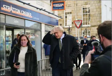  ?? REUTERS ?? British Prime Minister Boris Johnson walks to visit Ann’s Cottage Surf Shop in Truro, Cornwall, Britain on 7 April 2021.