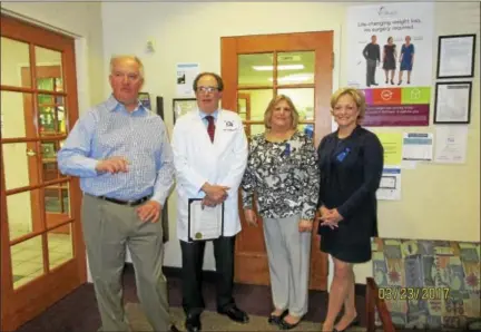  ?? CONTRIBUTE­D PHOTO ?? Mayor Elinor Carbone, right, joined here by city employee Emily Barbero, and hospital officials, issued a proclamati­on marking colorectal cancer awareness month last week.