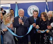  ?? AP/RONEN ZVULUN ?? Israeli Prime Minister Benjamin Netanyahu (third from left); his wife, Sara (beside him); and Guatemalan President Jimmy Morales (center) watch Wednesday as Morales’ wife Hilda Patricia Marroquin cuts the ribbon dedicating the Guatemalan Embassy in...