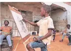  ?? FOTO: DPA ?? Der elfjährige Kareem Waris Olamilekan zeichnet das Gesicht einer Frau.