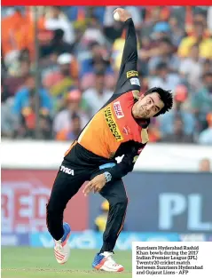  ??  ?? Sunrisers Hyderabad Rashid Khan bowls during the 2017 Indian Premier League (IPL) Twenty20 cricket match between Sunrisers Hyderabad and Gujarat Lions - AFP