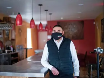  ??  ?? Azteca Mexican Grill co-owner Gustavo Sarazua stands for a portrait Wednesday (March 23) at his restaurant.