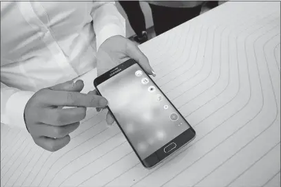  ?? [MARY ALTAFFER/THE ASSOCIATED PRESS] ?? A product expert demonstrat­es the Samsung Galaxy S6 Edge Plus during a presentati­on at Lincoln Center in New York in August 2015. Apple’s new iPhone X has special features and its price tag is appropriat­ely special: $999. But a solid new phone doesn’t...