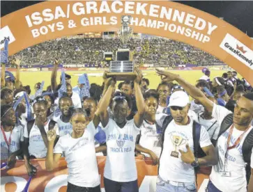  ?? Garfield Robinson) (Photo: ?? Edwin Allen High School celebrate with the Girls’ Champs trophy in 2019.