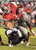  ?? ARIEL COBBERT, THE COMMERCIAL APPEAL ?? Germantown running Eric Foster (4) carries the ball during an Oct. 26 game between the Red Devils and Whitehaven.