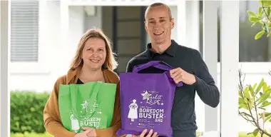  ?? SIMON O’CONNOR/STUFF ?? Sarah and Roland Devine who run Gabby’s Starlit Hope fill the boredom bags with craft activities and toys to keep children amused in hospital.