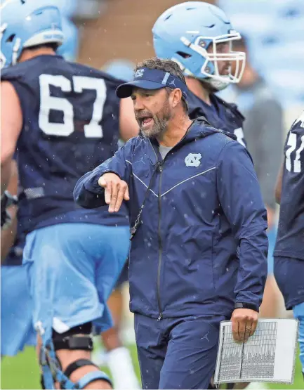  ??  ?? North Carolina coach Larry Fedora directs his team during practice Aug. 3 in Chapel Hill, N.C. GERRY BROOME/AP