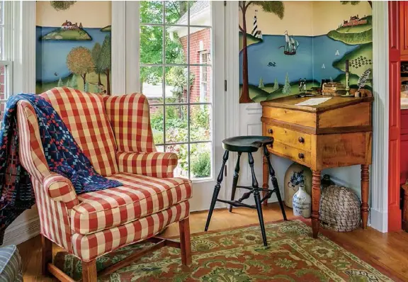  ??  ?? Above: Rather than hang traditiona­l art in the sunroom, Vicki painted a wall mural, drawing inspiratio­n from several sources. Just as prolific New England muralist Rufus Porter did, she incorporat­ed stencils to simplify the process. The tiger maple...