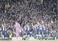  ?? ?? Scotland players and fans celebrate after the win over Israel