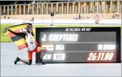  ?? AFP ?? Ugandan athlete Joshua Cheptegei celebrates after breaking the 10,000m track world record.