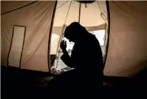  ??  ?? A 33-year-old mother of six, Zahra, in her tent in the Salamiya camp for internally displaced people, where she and her family have lived for seven months.