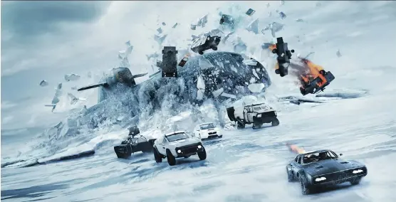  ?? PHOTOS: UNIVERSAL PICTURES ?? Spoiler alert! Yes, that is indeed a submarine chasing a bunch of cars across an icy expanse in The Fate of the Furious, the eighth movie in the franchise.
