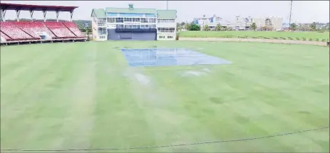  ??  ?? COVERED UP! Rain fell consistent­ly yesterday forcing the first Guyana Cricket Board U19 Franchise match between General Marine Eagles and Tropical Spring Falcons to be abandoned.