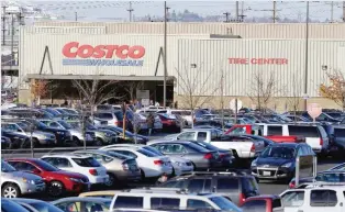  ??  ?? SEATTLE: In this Tuesday, Nov 24, 2015, file photo, cars fill the parking lot of a Costco store in Seattle. A California farm is recalling a vegetable mix believed to be the source of E.coli in Costco chicken salad that has been linked to an outbreak...