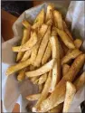  ?? (Arkansas Democrat-Gazette/ Kimberly Dishongh) ?? The fries at Leo’s Greek Castle are seasoned with a blackened redfish mix and a proprietar­y blend of spices.