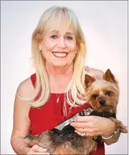  ??  ?? Racquel “Rocky” Wright, 71, Yuba City, with her Yorkshire terrier, Dakota spent 28 years in the Army Nurse Corps and retired as a lieutenant colonel.