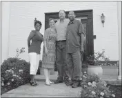  ??  ?? From left, Dee Williamson of White Plains, a student’s grandmothe­r, Georgia and Philip Bonney and Keir Lyles of La Plata, a cartoon drawing instructor, pose in front of the Bonney home.