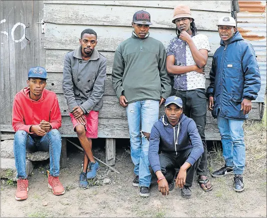  ??  ?? IN LIMBO: Among the Duncan Village youth struggling to find work are, from left, Sibusiso Kangela, Siyabonga Nceke, Mzingabant­u Njelane, Anda Makata and Anathi Ntozakhe with Sphelo Busakwe in front