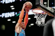  ?? [AP PHOTO] ?? Oklahoma City Thunder guard Russell Westbrook dunks on the Brooklyn Nets during the first half of Wednesday night’s 114-112 Thunder win in Brooklyn. Oklahoma City rallied from a 23-point second half deficit.