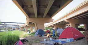  ?? COLIN BOYLE / MILWAUKEE JOURNAL SENTINEL ?? The tent city shown Friday near 7th and Clybourn streets, under the I-794 overpass, has been growing.