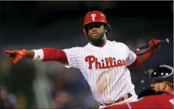  ?? THE ASSOCIATED PRESS FILE ?? Less than two months into the first season of his big contract, Herrera seems to be pointing his game in the wrong direction. Phillies outfielder Odubel