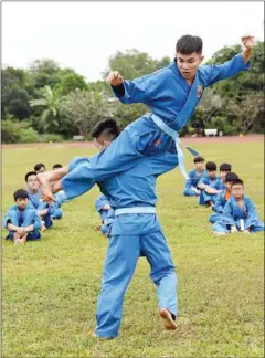  ?? HOANG DINH NAM/AFP ?? Students from the Research Institute for Vovinam and Sport Developmen­t, a boarding school set up to treat online addictions and discipline unruly youngsters, practise vovinam at the campus in Ho Chi Minh City on December 20.