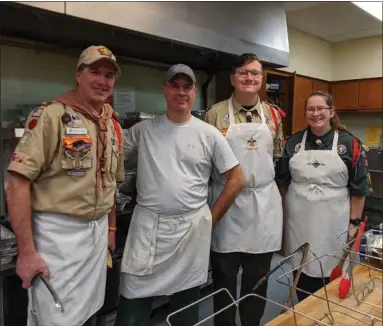  ?? RENEE BORCAS — THE NEWS-HERALD ?? Volunteers who prepared food for Willoughby United Methodist Church’s annual Free Christmas Dinner stop for a photo.