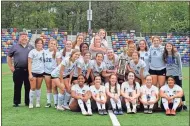  ?? Michael Baron ?? The Armuchee Lady Indians pose for a picture with their newest trophy after a 2-1 overtime win over Atlanta Classical Academy that captured the Region 6-A Public crown.